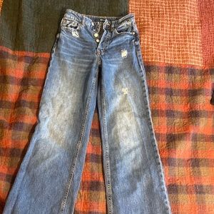 the smallest hole ever on the back side of jeans. small small hole.